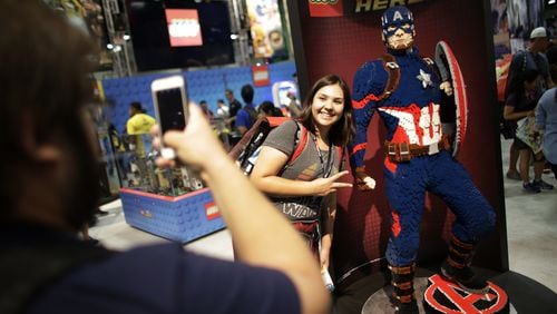 Danah Hernandez is photographerd by Gonzalo Glicia next to a Lego sculpture of Captain America at the Comic Con International in San Diego in July 2016. San Diego Comic-Con International will open a museum of popular culture in nearby Balboa Park. (Robert Gauthier/Los Angeles Times/TNS)