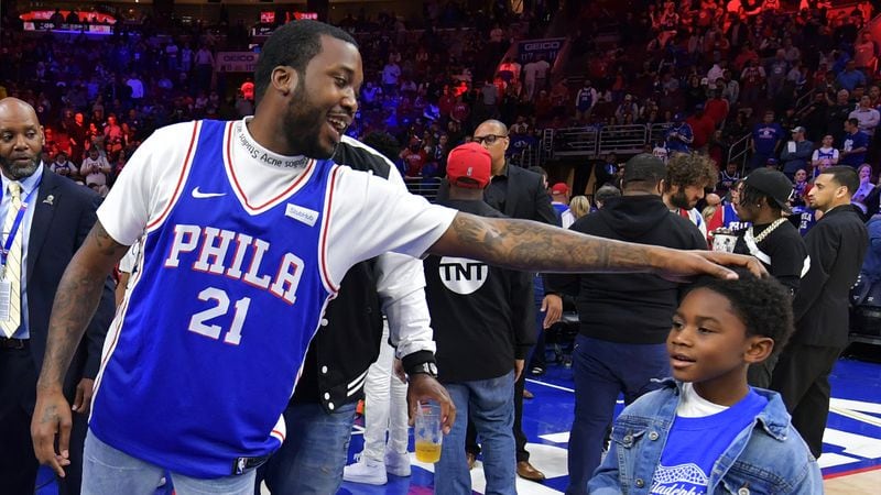 PHILADELPHIA, PA - APRIL 24: Rapper Meek Mill stands with his son Papi at halftime during the game between the Miami Heat and Philadelphia 76ers at Wells Fargo Center on April 24, 2018 in Philadelphia, Pennsylvania. (Photo by Drew Hallowell/Getty Images)
