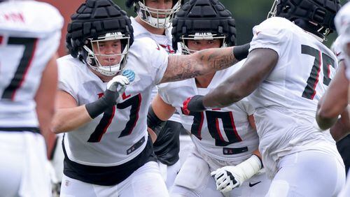 Falcons guard Jalen Mayfield (77), who started 16 games at left guard as a rookie in 2021, had his 21-day activation period started from injured reserve Wednesday. (Jason Getz / Jason.Getz@ajc.com)