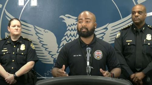 Atlanta police Detective Brian Hill addresses the media about a phone scam in which fraudsters impersonate high-ranking police officers and threaten victims with arrest if they don't make payments over the phone.