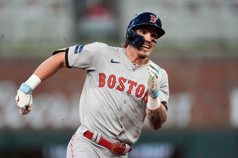 Boston Red Sox' Jarren Duran runs to third base after hitting a triple in the fifth inning of a baseball game against the Atlanta Braves Tuesday, May 7, 2024, in Atlanta. (AP Photo/John Bazemore)