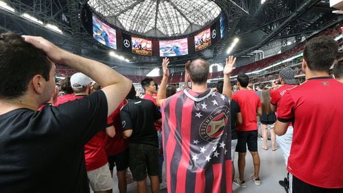 Atlanta United fans react after France scores a goal while watching the World Cup final on the halo board in Mercedes-Benz Stadium before their team takes on the Seattle Sounders in a MLS soccer game on Sunday, July 15, 2018, in Atlanta. Croatia, the crowd favorite, fell 4-2 to France. (Photo: Curtis Compton/ccompton@ajc.com)