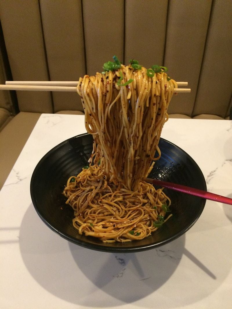 The cold Chengdu noodles are probably the most Instagrammable dish at Gu’s Kitchen on Buford Highway, thanks to the floating chopsticks presentation. CONTRIBUTED BY WENDELL BROCK