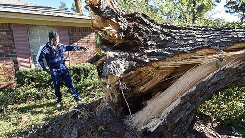 October 9, 2016 Savannah - Eric Riley walks through his damaged properties from Hurricane Matthew in Savannah on Sunday, October 9, 2016. Tens of thousands of coastal Georgia residents heeded the governor’s evacuation order and cleared out ahead of Hurricane Matthew. But now Matthew’s gone to other shores, and many of those Georgia storm refugees are still inland, waiting for the all-clear from back home. HYOSUB SHIN / HSHIN@AJC.COM