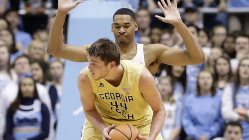 North Carolina's Garrison Brooks guards Georgia Tech's Ben Lammers (44) during the first half of an NCAA college basketball game in Chapel Hill, N.C., Saturday, Jan. 20, 2018. (AP Photo/Gerry Broome)