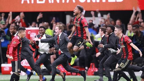 Dec 8, 2018: Atlanta United Josef Martinez leaps in the air and Miguel Almiron charges the field celebrating winning the MLS CUP 2-0 over the Portland Timbers.