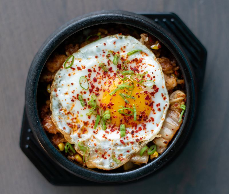 Noona Steakhosue & Oyster Bar in Duluth’s Parsons Alley has a great happy hour deal on oysters, but there’s much more on the menu, including its kimchi fried rice with a fried egg on top. CONTRIBUTED BY HENRI HOLLIS