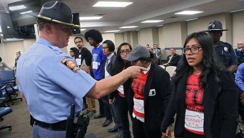 Protesters demonstrated against Georgia Board of Regents policies that bar immigrants without legal status from top schools and qualifying for in-state tuition rates at others. BOB ANDRES /BANDRES@AJC.COM