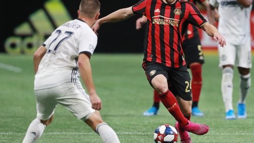 October 24, 2019 Atlanta: Atlanta United midfielder Julian Gressel passes the ball around Philadelphia defender Kai Wagner in the Eastern Conference semifinals of the MLS playoffs on Thursday, October 24, 2019, in Atlanta.   Curtis Compton/ccompton@ajc.com