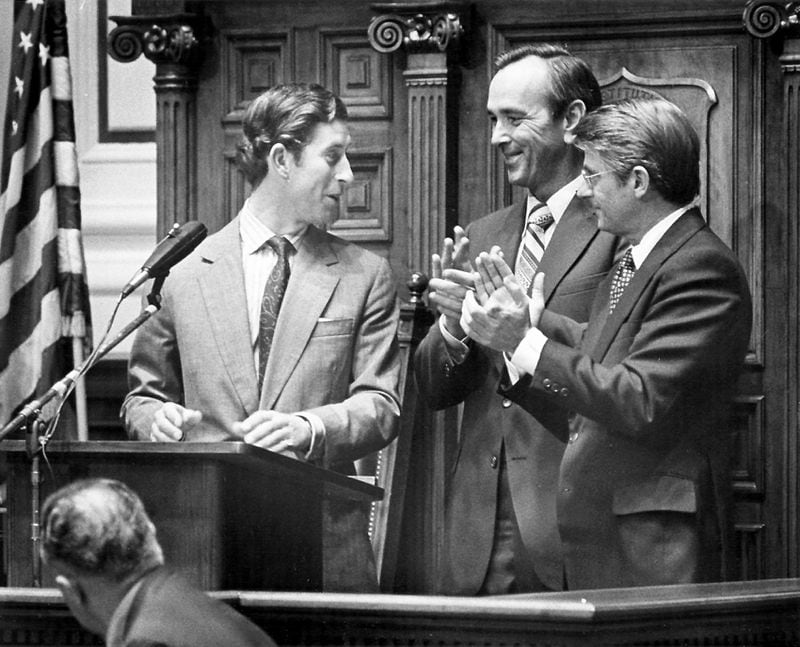 Prince Charles draws applause from Gov. Busbee and Lt. Gov. Miller at the State Capitol, Oct. 22, 1977. (AJC Staff Photo/Minla Linn)