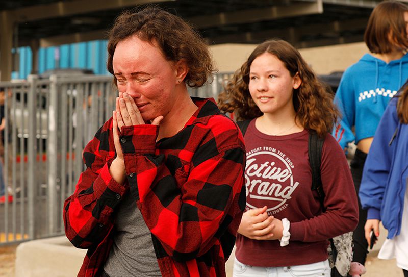 Some students were in tears as they were escorted by police from the school.