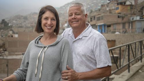 Jack and Carolyn Canouse of Alpharetta in San Juan de Lurigancho, Lima, Peru. The couple founded the nonprofit Make a Miracle to help students from this area get a college education. Courtesy of Brooklyn Etzel and Make a Miracle