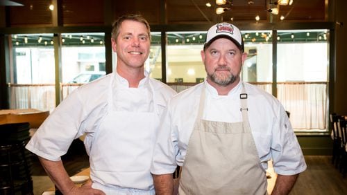Chef/owners Lance Gummere and Shaun Doty (left to right) in the dining room at he Federal. Photo credit- Mia Yakel.