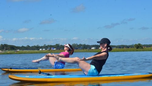 Kayak Amelia offers classes in stand up paddle board yoga on Simpson Creek in Little Talbot Island State Park near Amelia Island, Florida. 
Courtesy of Wesley K.H. Teo