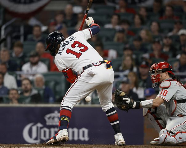 Atlanta Braves right fielder Ronald Acuna is hit by a Philadelphia Phillies pitch during the sixth inning of game two of the National League Division Series at Truist Park in Atlanta on Wednesday, October 12, 2022. (Jason Getz / Jason.Getz@ajc.com)
