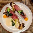 The duck breast at Foundation Social Eatery is served with marinated oyster mushrooms, brined bok choy and kumquat gel. Angela Hansberger for The Atlanta Journal-Constitution