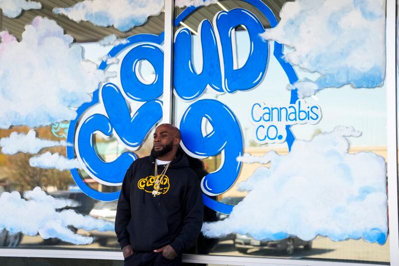 Cloud 9 Cannabis CEO and co-owner Sam Ward Jr. poses outside his store, Saturday, April 13, 2024, in Arlington, Wash. The shop is one of the first dispensaries to open under the Washington Liquor and Cannabis Board's social equity program, established in efforts to remedy some of the disproportionate effects marijuana prohibition had on communities of color. (AP Photo/Lindsey Wasson)