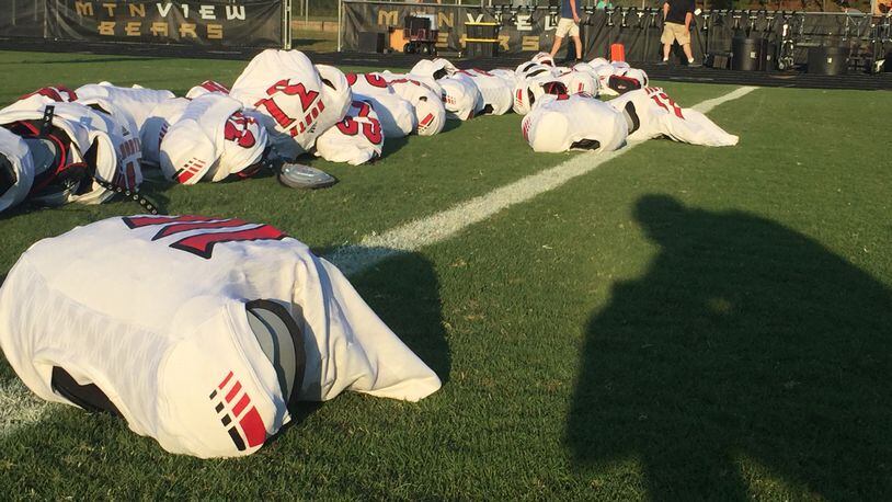 North Gwinnett jerseys and should pads lay on the sideline before the North Gwinnett, Mountain VIew game on Sept. 22, 2017. The Bulldogs won 27-14. (Photo Credit/ Alex Makrides)