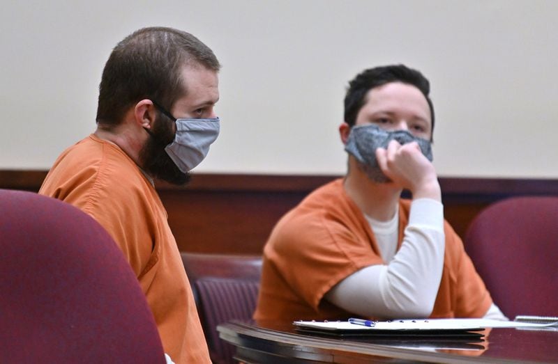 Michael Helterbrand (left) and Jacob Kaderli sit with their attorneys Radford Bunker and John Lovell (both not pictured) during their preliminary hearing before Judge Jack Niedrach at Floyd County Superior Court in Rome on Friday, May 29, 2020. Jacob Kaderli and Michael Helterbrand were in court Friday for a preliminary hearing and another attempt to get bond set for their charges of attempted murder. Luke Lane, Jacob Kaderli and Michael Helterbrand are accused belonging to an international terror group called The Base and of plotting the murder of a Bartow County couple they believed to be involved in anti-racist demonstrations. HYOSUB SHIN / HYOSUB.SHIN@AJC.COM