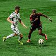 Atlanta United's Xande Silva (right) dribbles against D.C. United at Mercedes-Benz Stadium on Saturday, May 11, 2024. Atlanta United lost 3-2.