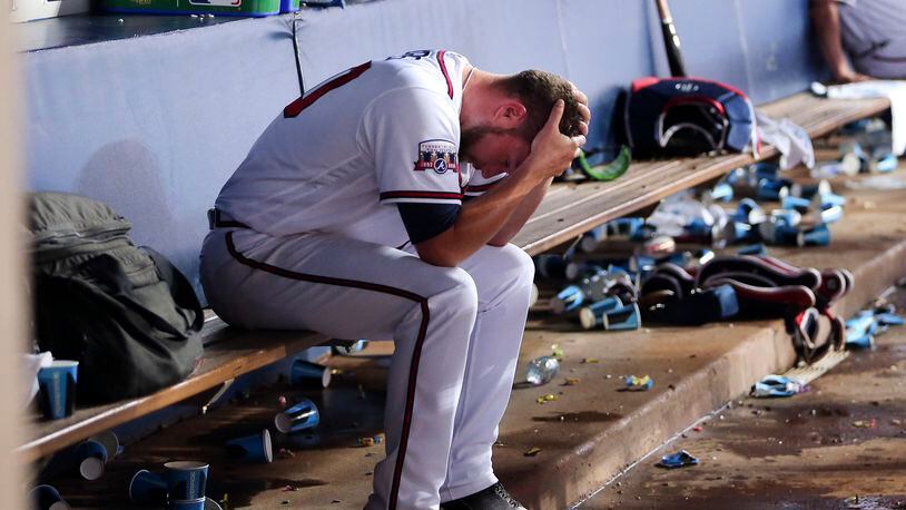 Atlanta Braves starting pitcher Bud Norris (20) sits on the bench during the Braves' half of the eighth inning of baseball game against the Milwaukee Brewers on Tuesday, May 24, 2016, in Atlanta. Norris allowed the go-ahead run in the eighth. (AP Photo/John Bazemore)