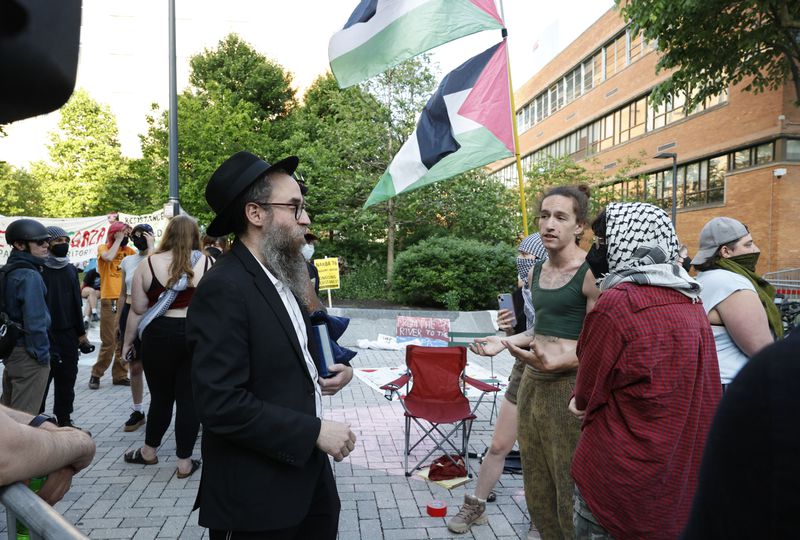Rabbi Chiam Goldstein from Drexel Chabad fraternity is not allowed to pass into the encampment to meet with Jews that are protesting with the pro-Palestinian students at Drexel University, Monday, May 20, 2024, in Philadelphia. (Steven M. Falk/The Philadelphia Inquirer via AP)