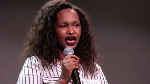 Anamaliya, author of “Terrorized in Rwanda: Healed by Grace,” speaks to the crowd during Rally for Resettlement, a solidarity event for refugees and agencies, held at Clarkston International Bible Church in Clarkston, Georgia, on Saturday, Sept. 28, 2019. (Photo: Rebecca Wright / Special to the AJC)