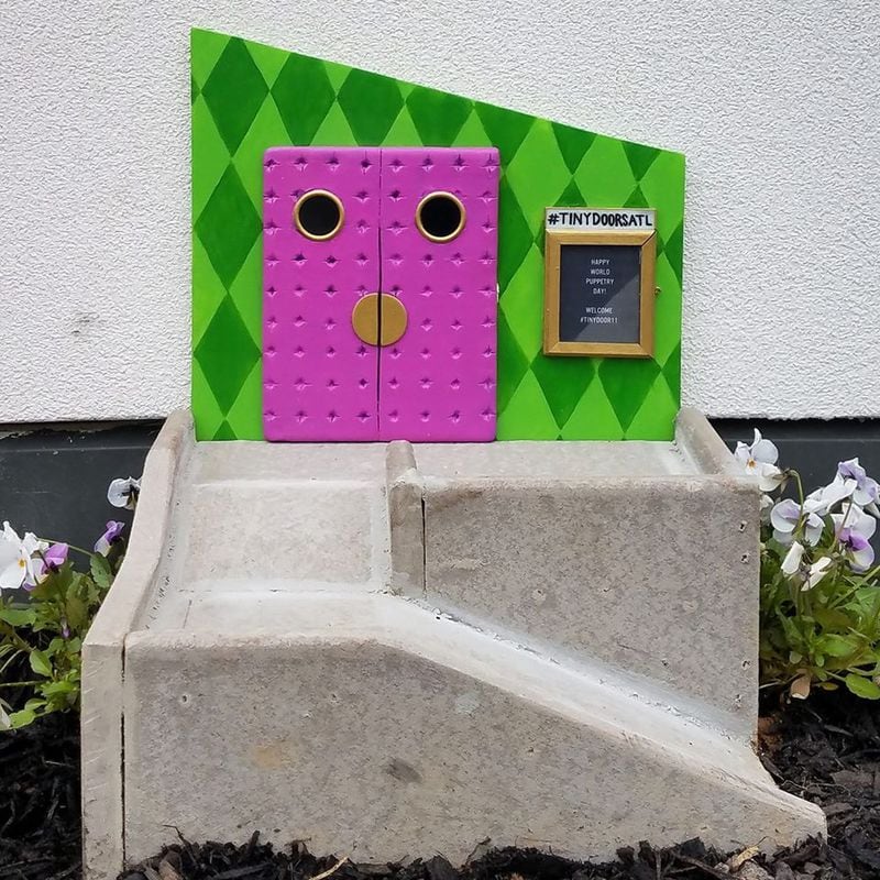 One of the small public art installments created by Tiny Doors ATL. Door #11, located at the Center for Puppetry Arts in Atlanta,  includes a tiny wheelchair ramp to highlight the importance of accessibility. Photo courtesy of Tiny Doors ATL