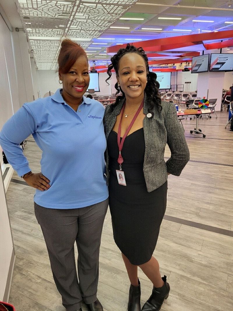 Spelman College online student Darlene Perkins and Tiffany Watson, vice president of eSpelman operations at a graduation and education fair in Detroit.
