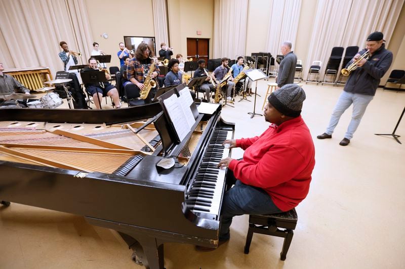 Louis Heriveaux rehearses with the Georgia State University jazz band for a Johnny Mercer tribute concert March 4. At the right is jazz trumpeter Joe Gransden. 
Miguel Martinez /miguel.martinezjimenez@ajc.com