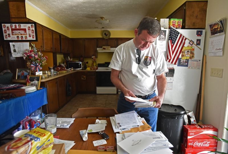 Ardie Wright glances at a stack of sympathy cards. He hasn’t had time to open them yet. People from across the country – neighbors, friends, even strangers – are writing to offer their condolences about the death of his son, Staff Sgt. Dustin Wright. “He was like John Wayne, OK?” Ardie said of his son. “When he walked through the door with his sparkling blue eyes – and his smile – he just lit the room up." HYOSUB SHIN / HSHIN@AJC.COM