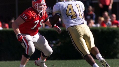 Matt Stinchcomb (79) blocks defensive end Jesse Tarplin of Georgia Tech in 1998. (KEVIN KEISTER // AJC file)