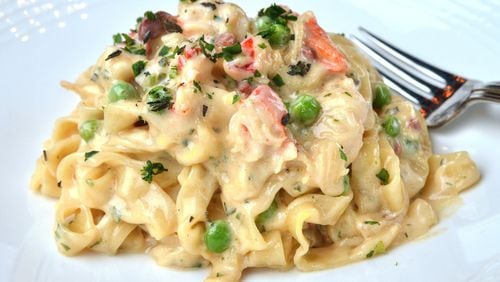 Osteria di Mare’s lobster carbonara is a luxurious play on the classic carbonara, with lobster, green peas and salty prosciutto stirred into house-made fettuccine. CHRIS HUNT / SPECIAL