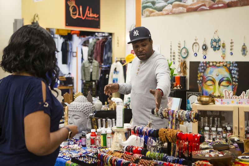 Rovel Buchanan sells his products at the New Black Wall Street Market, on Saturday, Oct. 15, 2022, in Lithonia, Georgia. The market has been in operation for over a year and gives black business owners the opportunity to sell their products. CHRISTINA MATACOTTA FOR THE ATLANTA JOURNAL-CONSTITUTION