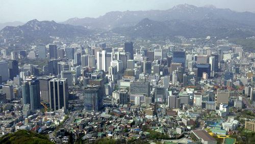 A city view is seen from the observation deck of Seoul Tower, South Korea. With the South Korean currency, called the won, down against the dollar, now's the time to wander the grounds of 600-year-old palaces, meditate in Buddhist temples and trawl cafes and markets in the labyrinthine capital city, Seoul.