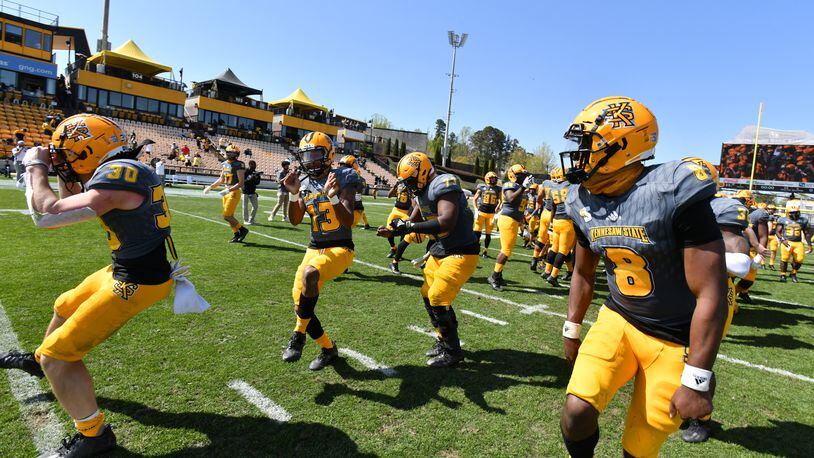 Kennesaw State players celebrate their victory during a spring football game at Fifth Third Bank Stadium in Kennesaw on Saturday, March 3, 2021. Kennesaw State won 35-0 over Robert Morris. (Hyosub Shin / Hyosub.Shin@ajc.com)