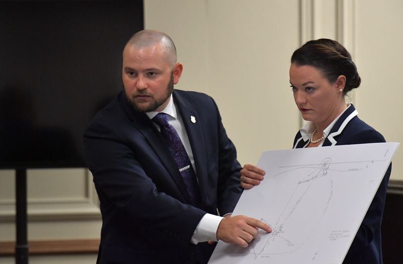June 25, 2018 Griffin - GBI special agent Jared Coleman, who helped bring the 35-year-old cold case to trial, testifies as Marie Broder, assistant DA, holds a diagram of crime scene during the murder trial of Franklin Gebhardt at the Spalding County Courthouse on Tuesday, June 25, 2018. HYOSUB SHIN / HSHIN@AJC.COM