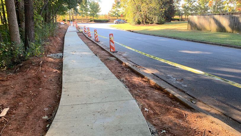After completing a new stretch of sidewalk, Dunwoody Public Works is adding two new pedestrian refuge islands to busy roads. This safety enhancement was just completed at Windwood Hollow Park where the sidewalk is extended to connect the linear park. CONTRIBUTED