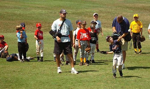 Smoltz coaches young fans at baseball camp