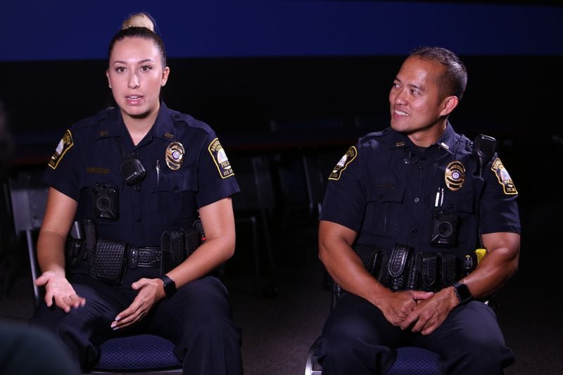 Officers Andrea Serrano (left) and Travis Nguyen speak about how they are trained to deal with encounters with people who become frustrated.