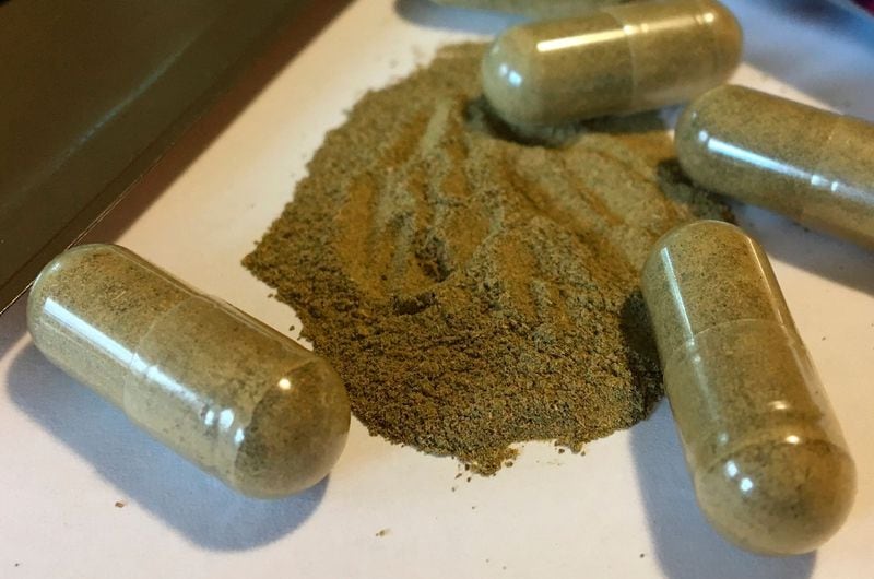 In this Sept. 27, 2017, file photo, kratom capsules are displayed in Albany, N.Y. U.S. health authorities are ordering a Las Vegas company to pull its herbal supplements off the market because some of its products tested positive for salmonella.