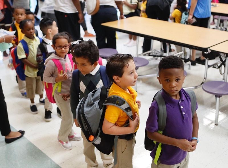 Community members as well as teachers greeted students as they returned to Hamilton E. Holmes Elementary School for the 2018-2019 school year.
