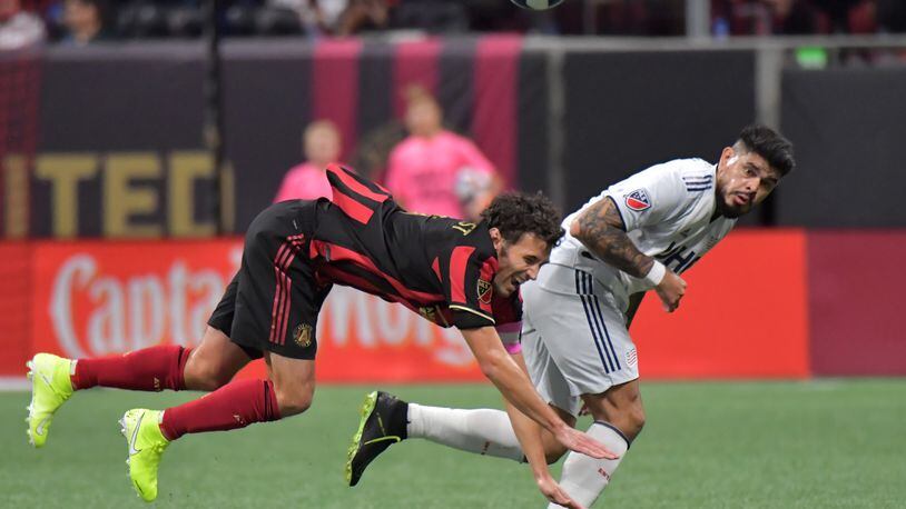 October 19, 2019 Atlanta - Atlanta United defender Michael Parkhurst (3) battles with New England Revolution forward Gustavo Bou (7) for the ball in the second half during the first round of the MLS playoffs at Mercedes-Benz Stadium on Saturday, October 19, 2019. Atlanta United won 1-0 over the New England Revolution. (Hyosub Shin / Hyosub.Shin@ajc.com)
