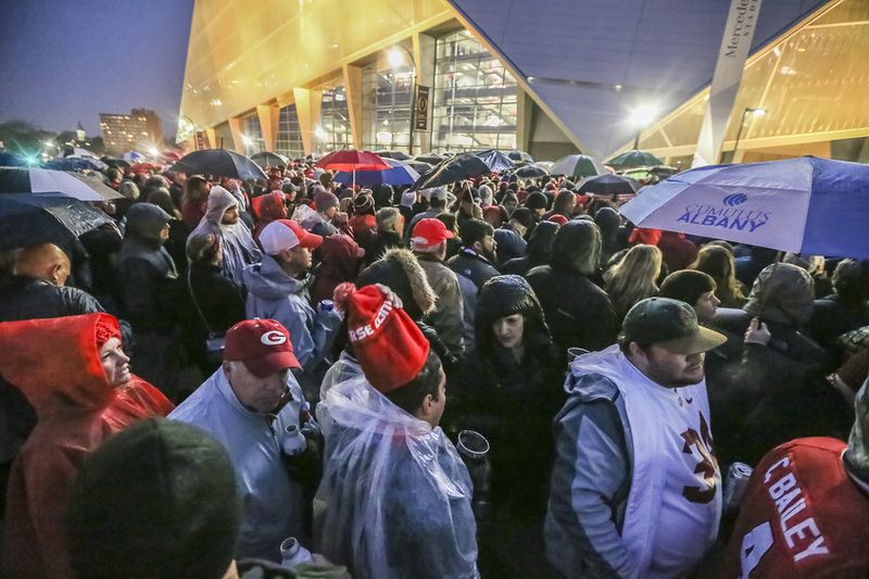 January 8, 2018 Atlanta: Crowds wait to get in the game in downtown Atlanta on Monday, Jan. 8, 2018, at Atlanta’­s Mercedes-Benz Stadium. JOHN SPINK/JSPINK@AJC.COM
