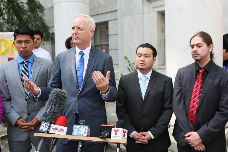 June,15 , 2017-Atlanta-  Attorney Charles Kuck, second from left, joins several of the immigrant plaintiffs in discussing the case with reporters after Thursday's hearing.  Moments earlier, he told the Georgia Appeals Court about the Board of Regents: “If the board wants to deny these kids in-state tuition, they should change their policy. It is really simple. I don’t think we would have a leg to stand on. But they haven’t done so. And as long as they haven’t done so we will fight for in-state tuition for these kids.”