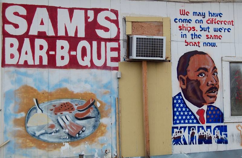 A mural at Sam's Bar-B-Que in Austin, Texas, depicts the Rev. Martin Luther King Jr. with a message of brotherhood. (Courtesy of Jim Auchmutey)