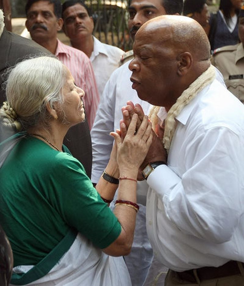 Congressman John Lewis, an icon of the civil rights movement, greets a close associate of Mahatma Gandhi as he, along with Martin Luther King III and King's wife Andrea, paid a visit to Mani Bhavan - Mahatma Gandhi 's residence in Mumbai. Lewis adopted Gandhi's nonviolent methods to bring change to American civil rights.