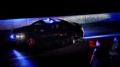 The driver of a 2021 Honda Accord was arrested after Cobb County police said he hit two patrol cars and injured two officers.