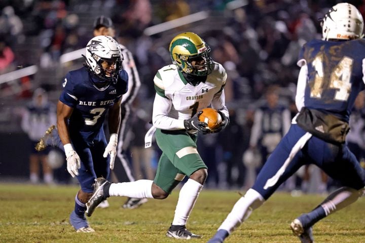 Dec. 18, 2020 - Norcross, Ga: Grayson wide receiver Jamal Haynes (1) scores a touchdown against Norcross defense back Zion Alexander (3) in the first half of the Class AAAAAAA semi-final game at Norcross high school Friday, December 18, 2020 in Suwanee, Ga.. JASON GETZ FOR THE ATLANTA JOURNAL-CONSTITUTION
