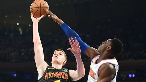 Knicks rookie RJ Barrett blocks the shot of Atlanta's Kevin Huerter during Tuesday's Hawks-Knicks game. (Photo by Emilee Chinn/Getty Images)